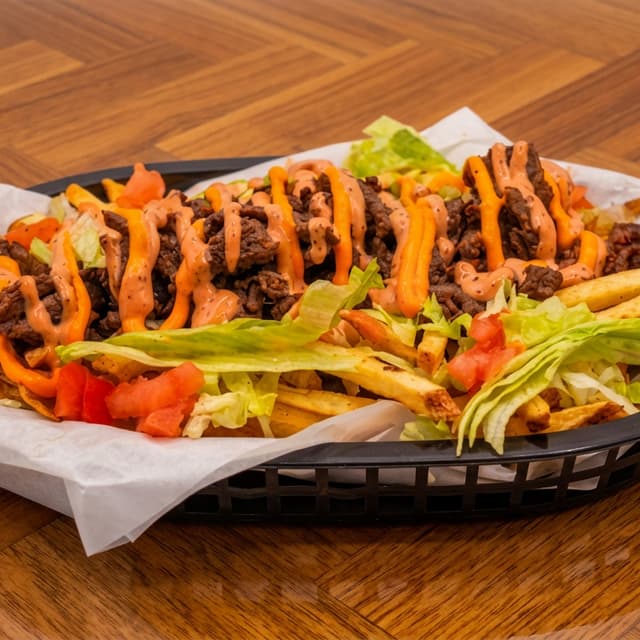 Papas Locas Bistec — Loaded Fries · Steak & Cheese. Authentic Puerto Rican food at El Punto Sandwichera, Allentown, PA.