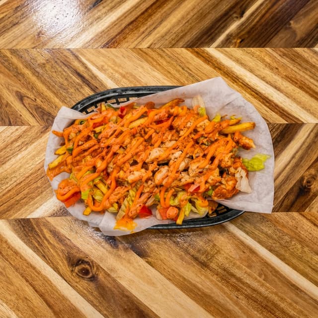 Papas Locas Tripleta — Loaded Fries · Chicken, Pork, Ham. Authentic Puerto Rican food at El Punto Sandwichera, Allentown, PA.
